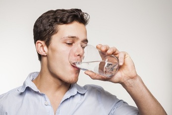 a manual wash down the capsules with a glass of water